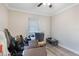 This bedroom features wood-look floors and a window with blinds at 2303 Mahoney Ave, Leesburg, FL 34748