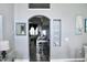 Hallway with an archway leading to living area, showcasing modern decor and design at 2511 Crown Ridge Cir, Kissimmee, FL 34744