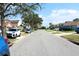 Wide street view showing neighborhood homes, landscaping, and parked vehicles at 2511 Crown Ridge Cir, Kissimmee, FL 34744