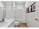 Bathroom featuring a tub with shower, wood-look tile flooring, and vanity with sink at 2626 Calistoga Ave, Kissimmee, FL 34741