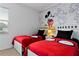 Fun bedroom with two beds, Mickey Mouse themed decor, perfect for or Disney enthusiasts at 2626 Calistoga Ave, Kissimmee, FL 34741