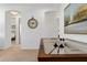 Upstairs hallway featuring an air hockey table and neutral colored walls with artwork at 2626 Calistoga Ave, Kissimmee, FL 34741