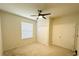 Bedroom featuring a ceiling fan, a large window and closet storage at 2706 Vermillion Ct, St Cloud, FL 34771