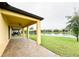 The brick back patio features a ceiling fan, overlooks a lake, and includes patio furniture at 2706 Vermillion Ct, St Cloud, FL 34771