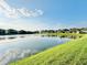 A view of a long pond with houses and neighborhood features in the background at 2706 Vermillion Ct, St Cloud, FL 34771