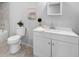 Clean bathroom with white vanity, modern faucet, stylish mirror, and tile accents at 2730 W Highland St, Lakeland, FL 33815