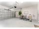 Spacious garage featuring an office area, fan and plenty of storage space at 2929 Satire St, Kissimmee, FL 34746