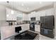 Bright kitchen with white cabinetry, stainless steel appliances, and a modern design at 2929 Satire St, Kissimmee, FL 34746