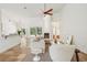 Bright living room features tile floors, neutral walls, fireplace, and views of the outdoor greenery at 2958 Willow Bay Ter, Casselberry, FL 32707