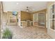 An outdoor kitchen is featured on the brick patio, complete with a ceiling fan and mounted television at 2958 Willow Bay Ter, Casselberry, FL 32707