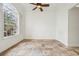 Bright room with large arched window, shutter detail, and ceiling fan at 2958 Willow Bay Ter, Casselberry, FL 32707