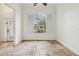 Bright room with large arched window and shutter detail, and tile flooring at 2958 Willow Bay Ter, Casselberry, FL 32707