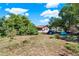Backyard of a property, with lush trees and space for outdoor recreation and camping at 30 Cornwall Ct, Casselberry, FL 32707