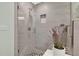 Modern bathroom featuring a glass enclosed shower with bench and niche shelving at 30 Cornwall Ct, Casselberry, FL 32707