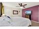 Bedroom showcasing a king-size bed, dresser, and ceiling fan at 30 Cornwall Ct, Casselberry, FL 32707