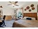 Bright bedroom with a light ceiling fan and a unique shelf display with hanging hammock chair at 30 Cornwall Ct, Casselberry, FL 32707