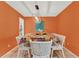 Eat-in-kitchen area showcasing the dining table set with a colorful tablecloth and overhead lighting at 30 Cornwall Ct, Casselberry, FL 32707