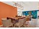 Open-concept dining area, with a modern light fixture and views into the living room at 30 Cornwall Ct, Casselberry, FL 32707