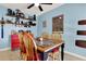 Casual dining space with vibrant wall decor and a decorative shelving display at 30 Cornwall Ct, Casselberry, FL 32707