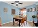 Cozy dining area with a unique table setting, chairs, and neutral tile flooring at 30 Cornwall Ct, Casselberry, FL 32707