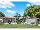 Charming single-story home with well-maintained lawn, two car garage, and solar panels at 30 Cornwall Ct, Casselberry, FL 32707