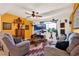 Inviting living room featuring comfortable seating, a ceiling fan, and a large screen television at 30 Cornwall Ct, Casselberry, FL 32707