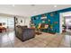 Spacious living room with bright walls, unique decor, and neutral tiled flooring at 30 Cornwall Ct, Casselberry, FL 32707