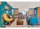 Stylish living room showcasing tile floors, comfortable seating, and blue and orange color scheme at 30 Cornwall Ct, Casselberry, FL 32707