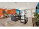 Open living room with tile flooring, a view of the dining area, and a cozy seating arrangement at 30 Cornwall Ct, Casselberry, FL 32707