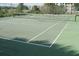 Community tennis court featuring well-maintained surface and net for outdoor games at 3162 Sun Lake Ct # B, Kissimmee, FL 34747