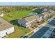 Aerial view of townhome community near a scenic pond, showcasing a well-planned neighborhood at 319 Smugglers Way, Apopka, FL 32712