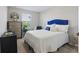 Cozy bedroom featuring bed with blue headboard, dresser, and lots of light at 319 Smugglers Way, Apopka, FL 32712