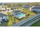 Aerial view of community pool and lounge area. Pool features palm trees and manicured landscape at 319 Smugglers Way, Apopka, FL 32712