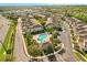 Aerial view of community with swimming pool, landscaping and residential buildings at 409 Hilgard Cv # 106, Sanford, FL 32771