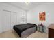 Cozy bedroom with closet and natural light from the window with blinds at 409 Hilgard Cv # 106, Sanford, FL 32771