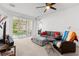 Comfortable living room featuring neutral colors and large sliding glass doors at 409 Hilgard Cv # 106, Sanford, FL 32771