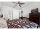 Spacious main bedroom featuring a ceiling fan and an en-suite bath at 409 Hilgard Cv # 106, Sanford, FL 32771