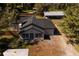 Aerial view of charming single-story home with grey roof, fenced yard, and detached garage at 4452 Fairview Ave, Orlando, FL 32804