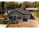 Overhead view of a charming single-story home featuring a grey roof, fenced yard, and a detached garage at 4452 Fairview Ave, Orlando, FL 32804