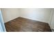 Finished basement with wood-look tile flooring and clean, neutral walls at 4452 Fairview Ave, Orlando, FL 32804