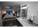 Stylish bathroom boasting marble countertop, decorative mirror, and an elegant bedroom view at 4452 Fairview Ave, Orlando, FL 32804