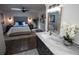 Bright bathroom featuring marble countertops, decorative mirror, and a view of the bedroom space at 4452 Fairview Ave, Orlando, FL 32804