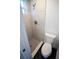 Modern bathroom features sleek white tile shower and toilet at 4452 Fairview Ave, Orlando, FL 32804