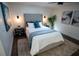 Bedroom featuring a tufted headboard, plush carpet, and dark wood-look floors creating a comfortable space at 4452 Fairview Ave, Orlando, FL 32804