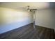 Neutral living room with wood flooring and a ceiling fan, offering a versatile space at 4452 Fairview Ave, Orlando, FL 32804