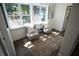 Cozy sunroom with natural light and matching chairs creating an inviting seating area at 4452 Fairview Ave, Orlando, FL 32804