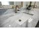 Close-up of the bathroom vanity featuring a marble countertop and modern faucet at 4452 Fairview Ave, Orlando, FL 32804