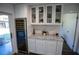 Stylish wet bar featuring marble countertops, white cabinetry, and a built-in wine cooler at 4452 Fairview Ave, Orlando, FL 32804