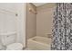 Bathroom featuring a tiled shower and toilet at 451 Hunter Cir, Kissimmee, FL 34758