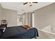 Spacious bedroom featuring neutral walls, a ceiling fan, and connecting doorway at 451 Hunter Cir, Kissimmee, FL 34758